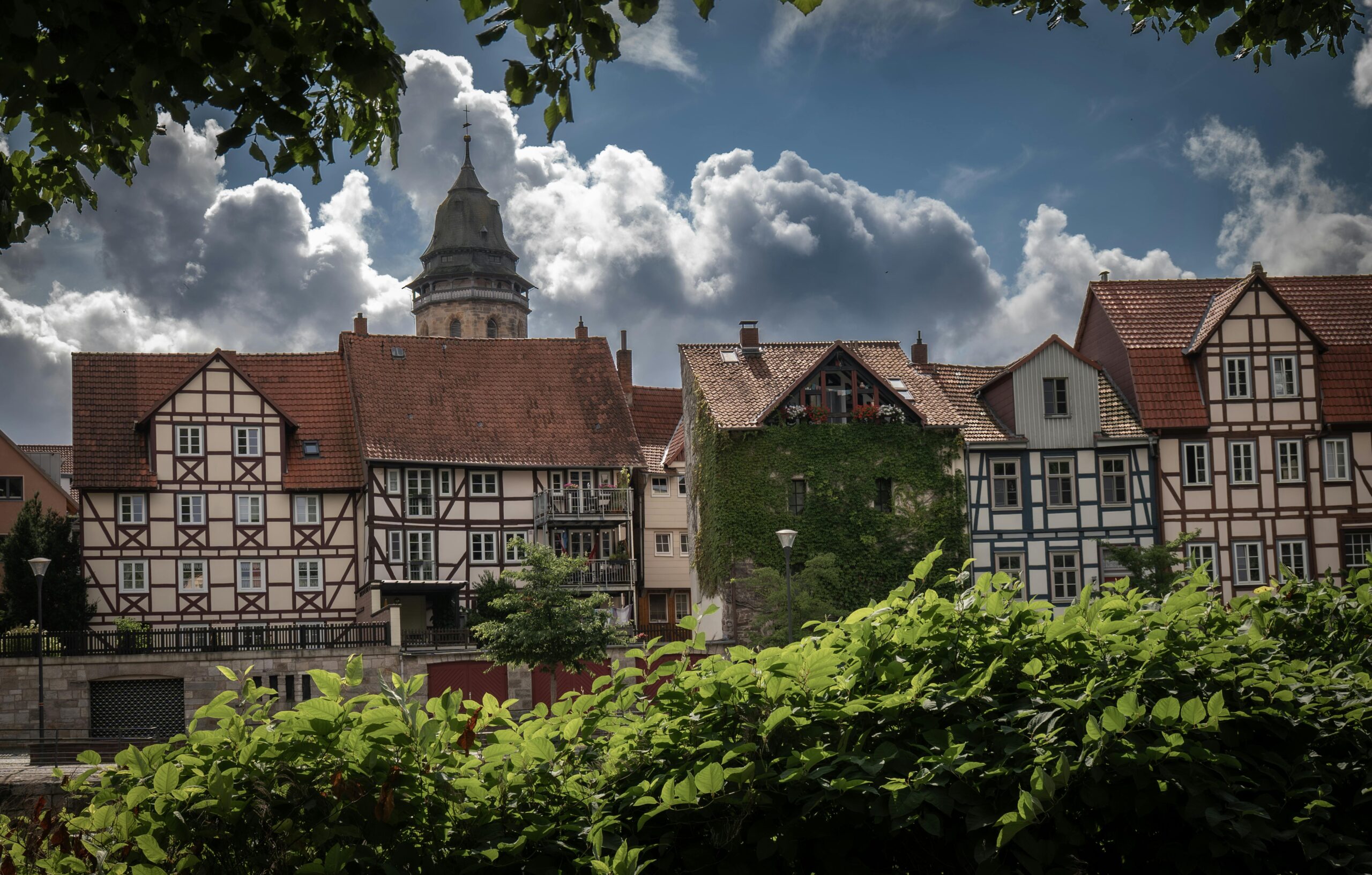 Idyllic view of half-timbered houses in Hann. Münden, Germany against dramatic clouds.